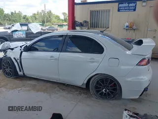 2015 Mitsubishi Lancer Evolution Final Edition with VIN JA32W7FVXFU027564, listed as a IAAI auction lot 41941191 with 52,235 mi miles. Bid and sale history available at carsss.com. Image 14.
