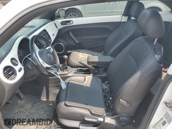 2013 Volkswagen Beetle with VIN 3VWHX7AT2DM656457, listed as a Copart auction lot 63814944 with 92,966 mi miles and Salvage Title. Bid and sale history available at DreamBid. Image 7.