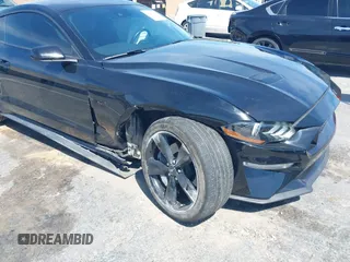 2021 Ford Mustang GT z VIN 1FA6P8CF4M5149580, wystawiony jako IAAI lot #41878355 z przebiegiem 60 028 mil mil oraz . Historia ofert i sprzedaży dostępna na DreamBid. Obrazek 6.