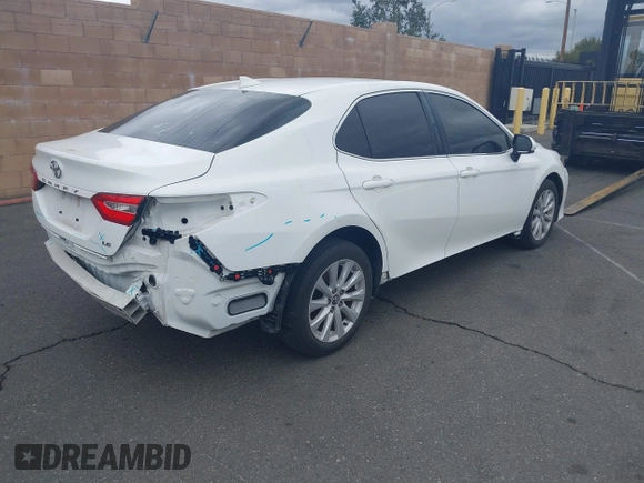 2020 Toyota Camry LE with VIN 4T1C11AK3LU882824, listed as a IAAI auction lot 41765544 with 48,209 mi miles and . Bid and sale history available at carsss.com. Image 4.