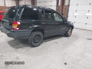 2003 Jeep Grand Cherokee Laredo with VIN 1J4GW48S63C552366, listed as a IAAI auction lot 41861501 with 227,464 mi miles. Bid and sale history available at carsss.com. Image 4.