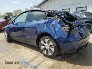 2022 Tesla Model Y Long Range z VIN 7SAYGDEE8NF447410, wystawiony jako Copart lot #54860765 z przebiegiem Nie podano mil oraz Szkody całkowita. Historia ofert i sprzedaży dostępna na DreamBid. Obrazek 2.