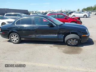 2003 Jaguar S-Type with VIN SAJEA01T13FM70486, listed as a IAAI auction lot 41989501 with 100,109 mi miles and . Bid and sale history available at DreamBid. Image 6.