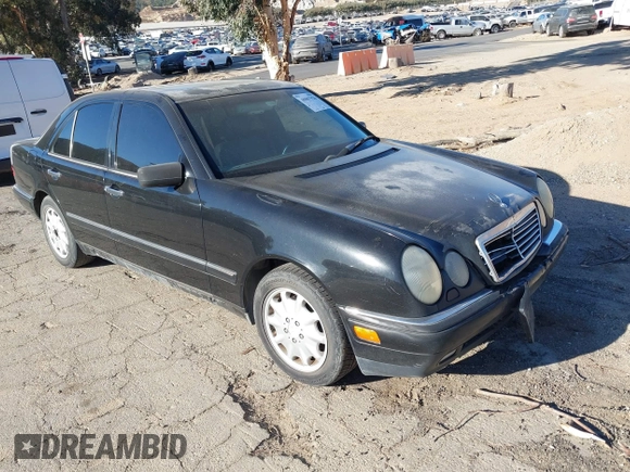 1997 Mercedes-Benz E-Class with VIN WDBJF55F6VJ032691, listed as a IAAI auction lot 40807926 with 215,262 mi miles. Bid and sale history available at carsss.com. Image 1.