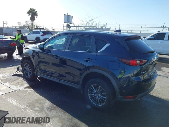 2019 Mazda CX-5 Touring with VIN JM3KFACM7K1534905, listed as a IAAI auction lot 41945607 with 56,014 mi miles. Bid and sale history available at carsss.com. Image 3.
