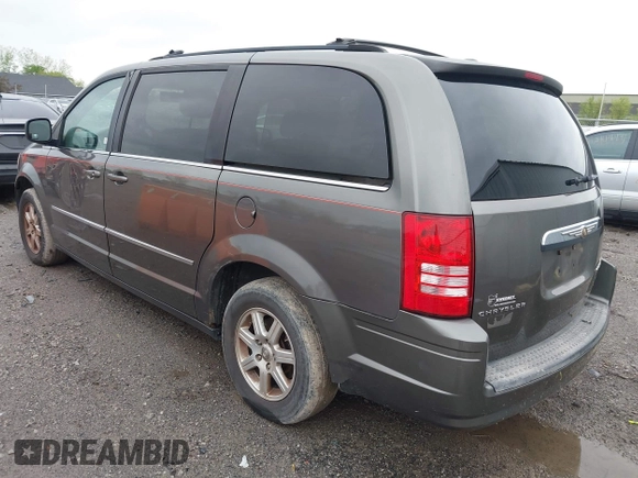 2010 Chrysler Town & Country Touring with VIN 2A4RR5D18AR386942, listed as a IAAI auction lot 42199851 with 143,924 mi miles and . Bid and sale history available at DreamBid. Image 3.