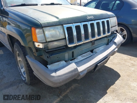 1996 Jeep Grand Cherokee Laredo with VIN 1J4GZ58S7TC280276, listed as a IAAI auction lot 42120454 with 230,617 mi miles. Bid and sale history available at carsss.com. Image 6.