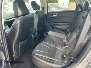 2020 Ford Edge Titanium z VIN 2FMPK3K95LBA30633, wystawiony jako IAAI lot #42473515 z przebiegiem 104 190 mil mil oraz . Historia ofert i sprzedaży dostępna na DreamBid. Obrazek 1.