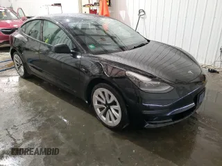2023 Tesla Model 3 with VIN 5YJ3E1EA8PF451324, listed as a Copart auction lot 88318475 with 74,582 mi miles and Salvage Title. Bid and sale history available at DreamBid. Image 4.