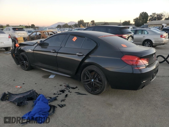2015 BMW 6 Series 640i z VIN WBA6A0C59FD318390, wystawiony jako Copart lot #87831165 z przebiegiem Nie podano mil oraz Szkoda całkowita • Salvage title. Historia ofert i sprzedaży dostępna na DreamBid. Obrazek 2.