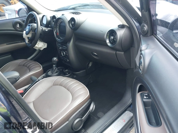 2015 MINI Countryman S z VIN WMWZC3C57FWT06297, wystawiony jako IAAI lot #41988157 z przebiegiem 74 461 mil mil oraz . Historia ofert i sprzedaży dostępna na DreamBid. Obrazek 5.