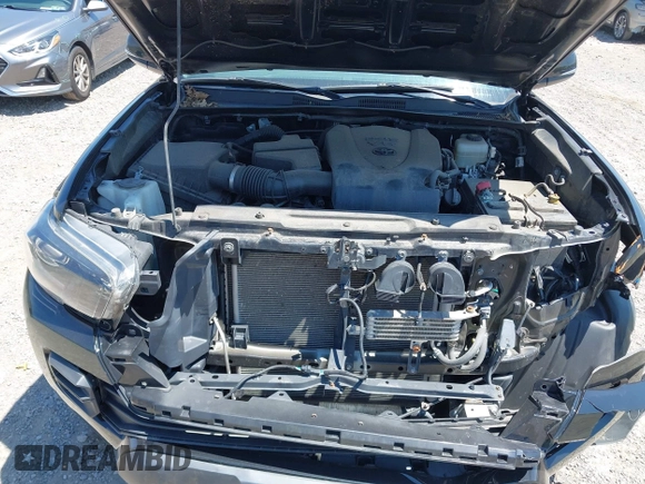 2019 Toyota Tacoma SR with VIN 5TFCZ5AN4KX208354, listed as a IAAI auction lot 42771410 with 77,509 mi miles and . Bid and sale history available at DreamBid. Image 10.