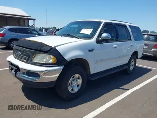 1997 Ford Expedition XLT z VIN 1FMFU18L3VLA65297, wystawiony jako IAAI lot #42418325 z przebiegiem 266 297 mil mil oraz . Historia ofert i sprzedaży dostępna na DreamBid. Obrazek 2.