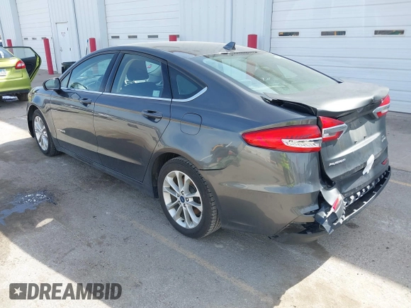 2019 Ford Fusion Hybrid SE with VIN 3FA6P0LU6KR163927, listed as a IAAI auction lot 41834612 with 104,342 mi miles. Bid and sale history available at carsss.com. Image 3.