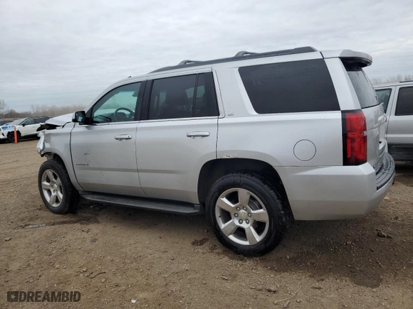 2015 Chevrolet Tahoe LS with VIN 1GNSKAKCXFR306859, listed as a Copart auction lot 83411724 with 154,517 mi miles and Salvage Title. Bid and sale history available at carsss.com. Image 2.