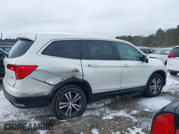 2017 Honda Pilot EX-L with VIN 5FNYF6H52HB015651, listed as a IAAI auction lot 41538814 with 121,433 mi miles and . Bid and sale history available at DreamBid. Image 13.