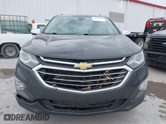 2021 Chevrolet Equinox Premier z VIN 2GNAXNEV9M6140537, wystawiony jako IAAI lot #42016514 z przebiegiem 52 237 mil mil oraz . Historia ofert i sprzedaży dostępna na DreamBid. Obrazek 12.