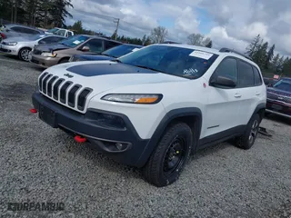 2015 Jeep Cherokee Trailhawk with VIN 1C4PJMBS4FW757314, listed as a IAAI auction lot 41916722 with 140,110 mi miles. Bid and sale history available at carsss.com. Image 17.