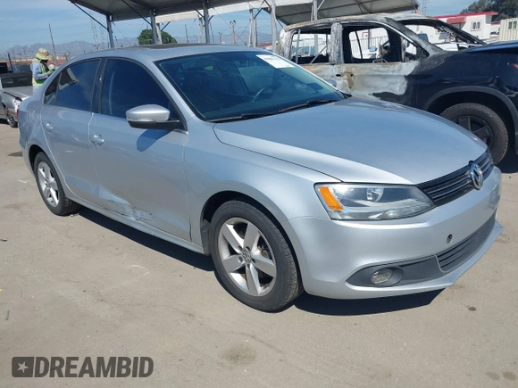 2012 Volkswagen Jetta TDI w/Premium with VIN 3VWLL7AJ8CM314305, listed as a IAAI auction lot 41885355 with 75,669 mi miles and . Bid and sale history available at DreamBid. Image 1.