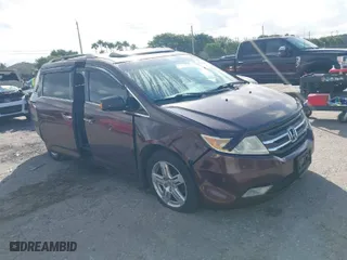 2011 Honda Odyssey Touring with VIN 5FNRL5H97BB008759, listed as a IAAI auction lot 41567010 with 215,709 mi miles. Bid and sale history available at carsss.com. Image 1.