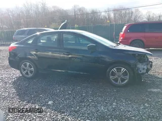 2018 Ford Focus SE z VIN 1FADP3FE9JL255818, wystawiony jako IAAI lot #42009017 z przebiegiem 79 329 mil mil oraz . Historia ofert i sprzedaży dostępna na DreamBid. Obrazek 14.