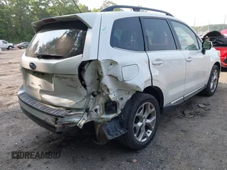 2015 Subaru Forester Touring with VIN JF2SJAWC9FH573973, listed as a IAAI auction lot 42380080 with 87,938 mi miles and . Bid and sale history available at DreamBid. Image 6.