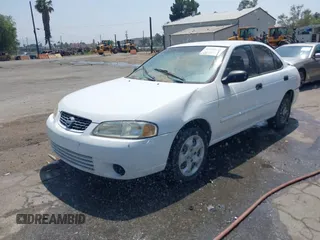 2003 Nissan Sentra XE z VIN 3N1CB51D83L696512, wystawiony jako IAAI lot #42454628 z przebiegiem 194 629 mil mil oraz . Historia ofert i sprzedaży dostępna na DreamBid. Obrazek 2.