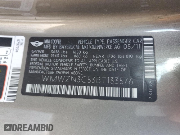 2011 MINI Convertible with VIN WMWZN3C53BT133576, listed as a Copart auction lot 87543835 with 69,999 mi miles and Salvage title. Bid and sale history available at DreamBid. Image 12.