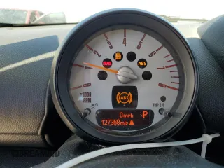 2014 MINI Countryman with VIN WMWZB3C56EWR38919, listed as a Copart auction lot 61385865 with 127,368 mi miles and Salvage title. Bid and sale history available at DreamBid. Image 9.