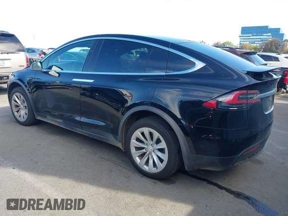 2020 Tesla Model X Long Range with VIN 5YJXCDE20LF265157, listed as a IAAI auction lot 41809572 with 58,599 mi miles. Bid and sale history available at carsss.com. Image 3.