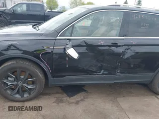 2024 Volkswagen Tiguan SE with VIN 3VVMB7AX7RM042855, listed as a IAAI auction lot 42223748 with 14,077 mi miles and . Bid and sale history available at DreamBid. Image 18.