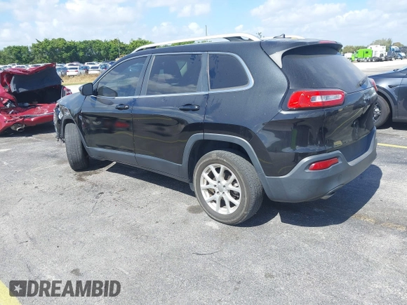 2015 Jeep Cherokee Latitude with VIN 1C4PJLCB4FW683904, listed as a IAAI auction lot 41579059 with 126,156 mi miles and . Bid and sale history available at carsss.com. Image 3.