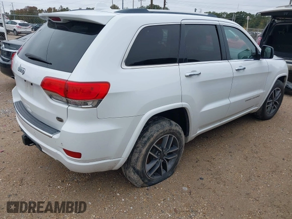 2014 Jeep Grand Cherokee Overland with VIN 1C4RJECG4EC543092, listed as a IAAI auction lot 40981315 with 149,096 mi miles. Bid and sale history available at carsss.com. Image 4.
