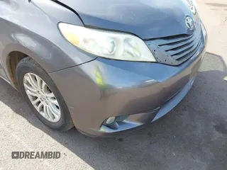 2014 Toyota Sienna XLE with VIN 5TDYK3DC2ES438980, listed as a IAAI auction lot 42067750 with 143,728 mi miles and . Bid and sale history available at DreamBid. Image 6.