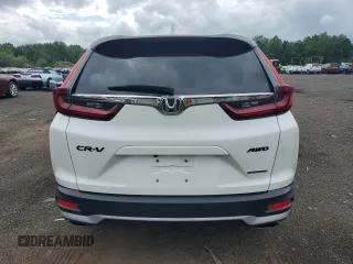 2020 Honda CR-V Touring z VIN 2HKRW2H90LH645727, wystawiony jako Copart lot #62077365 z przebiegiem 58 614 mil mil oraz Szkoda całkowita • Salvage title. Historia ofert i sprzedaży dostępna na DreamBid. Obrazek 6.