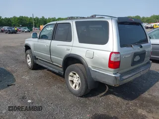 2000 Toyota 4Runner SR5 z VIN JT3HN86R7Y0290729, wystawiony jako IAAI lot #42409622 z przebiegiem 315 804 mil mil oraz . Historia ofert i sprzedaży dostępna na DreamBid. Obrazek 3.
