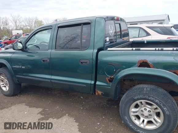 2001 Dodge Dakota Sport z VIN 1B7HG2ANX1S256902, wystawiony jako IAAI lot #42037703 z przebiegiem 121 914 mil mil oraz . Historia ofert i sprzedaży dostępna na DreamBid. Obrazek 14.