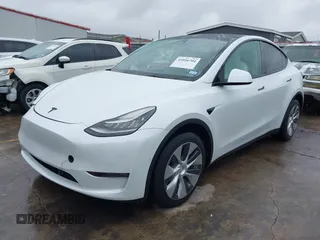 2022 Tesla Model Y Long Range with VIN 7SAYGDEE3NF380067, listed as a IAAI auction lot 41016704 with 52,180 mi miles and . Bid and sale history available at DreamBid. Image 2.