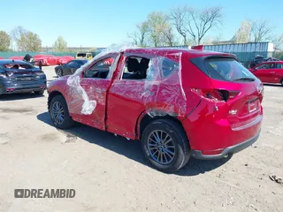 2019 Mazda CX-5 Sport with VIN JM3KFBBM6K1596402, listed as a IAAI auction lot 41971766 with 60,396 mi miles and . Bid and sale history available at DreamBid. Image 3.