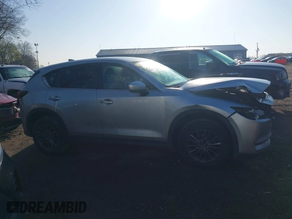 2020 Mazda CX-5 Touring with VIN JM3KFACM5L0766698, listed as a IAAI auction lot 42006157 with 80,288 mi miles and . Bid and sale history available at carsss.com. Image 13.