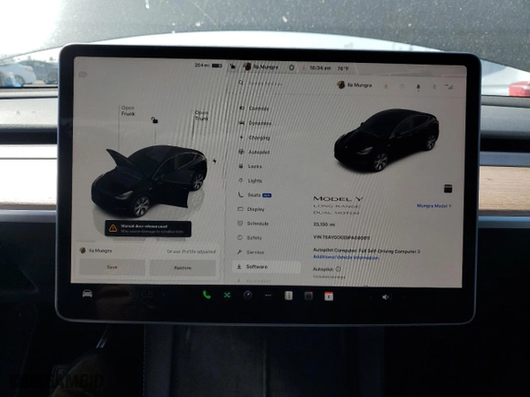 2023 Tesla Model Y Long Range with VIN 7SAYGDEE9PA080811, listed as a Copart auction lot 52088055 with 23,130 mi miles and Salvage Title. Bid and sale history available at carsss.com. Image 9.