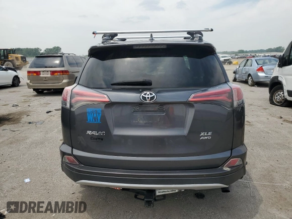 2016 Toyota RAV4 XLE with VIN 2T3RFREV0GW412875, listed as a Copart auction lot 59497545 with 226,604 mi miles and Salvage title. Bid and sale history available at DreamBid. Image 6.