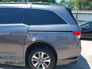 2015 Honda Odyssey Touring Elite z VIN 5FNRL5H99FB017517, wystawiony jako IAAI lot #42246066 z przebiegiem 104 878 mil mil oraz . Historia ofert i sprzedaży dostępna na DreamBid. Obrazek 18.