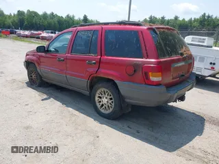 2001 Jeep Grand Cherokee Laredo z VIN 1J4GW48S11C720055, wystawiony jako IAAI lot #42453532 z przebiegiem 158 486 mil mil oraz . Historia ofert i sprzedaży dostępna na DreamBid. Obrazek 3.
