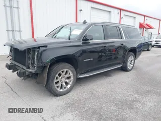 2015 GMC Yukon XL SLT with VIN 1GKS2HKC6FR746809, listed as a IAAI auction lot 41559570 with 144,401 mi miles. Bid and sale history available at carsss.com. Image 2.