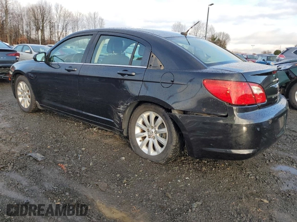 2010 Chrysler Sebring Limited with VIN 1C3CC5FB2AN120496, listed as a Copart auction lot 82131024 with 106,563 mi miles and Salvage Title. Bid and sale history available at carsss.com. Image 2.
