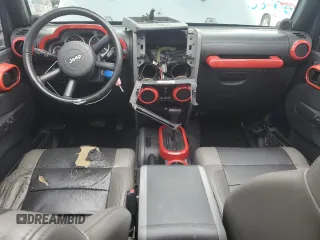 2007 Jeep Wrangler Unlimited Sahara with VIN 1J4GB59177L226122, listed as a Copart auction lot 55529575 with 208,811 mi miles and Salvage title. Bid and sale history available at DreamBid. Image 8.