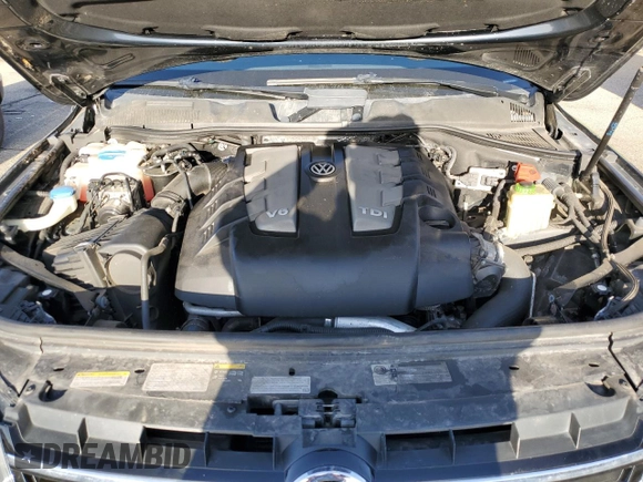2014 Volkswagen Touareg X z VIN WVGEP9BP5ED008560, wystawiony jako Copart lot #52767595 z przebiegiem Nie podano mil oraz Szkoda całkowita • Salvage title. Historia ofert i sprzedaży dostępna na DreamBid. Obrazek 14.