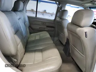 2000 Infiniti QX4 z VIN JNRAR07Y3YW084474, wystawiony jako Copart lot #87089994 z przebiegiem 237 974 mil mil oraz Szkody całkowita. Historia ofert i sprzedaży dostępna na DreamBid. Obrazek 11.