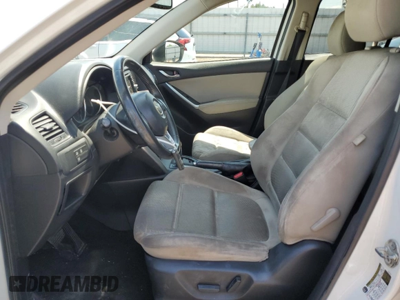2014 Mazda CX-5 Touring with VIN JM3KE2CY9E0305244, listed as a Copart auction lot 56205605 with 164,516 mi miles and Salvage Title. Bid and sale history available at DreamBid. Image 7.